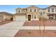 Two-story home with a two-car garage, neutral stucco, a tiled roof, and minimal desert landscaping in the front yard at 17264 W Via Dona Rd, Surprise, AZ 85387