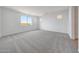 Serene bedroom featuring plush carpeting, natural light, and neutral color scheme at 17295 W Via Dona Rd, Surprise, AZ 85387