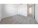 Carpeted bedroom with double door closet and a neutral color scheme offering a serene and inviting atmosphere at 17295 W Via Dona Rd, Surprise, AZ 85387