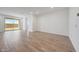 Bright living room features tile flooring, contemporary design, and sliding door access to the backyard at 17295 W Via Dona Rd, Surprise, AZ 85387