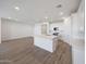Spacious living area features an open floor plan, and a contemporary kitchen with a large island at 17295 W Via Dona Rd, Surprise, AZ 85387