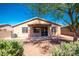 A well-maintained backyard with gravel landscaping and a covered patio space for outdoor relaxation at 17633 W Wind Song Ave, Goodyear, AZ 85338