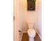 Small bathroom area featuring tile flooring, a toilet, and a small cabinet for storage at 17633 W Wind Song Ave, Goodyear, AZ 85338