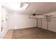 An empty two-car garage offers a clean, functional space for vehicle storage and home projects at 17633 W Wind Song Ave, Goodyear, AZ 85338