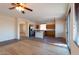Bright open kitchen with a center island, stainless appliances, and tile flooring at 17633 W Wind Song Ave, Goodyear, AZ 85338