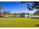 Scenic water feature and pristine landscaping create a picturesque scene at 17633 W Wind Song Ave, Goodyear, AZ 85338