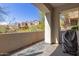 Covered outdoor patio with partial view of the surrounding desert landscape at 19550 N Grayhawk Dr # 1044, Scottsdale, AZ 85255