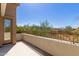 Balcony of a townhome with rod iron railing and Arizona desert view at 19550 N Grayhawk Dr # 1044, Scottsdale, AZ 85255