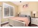 This bedroom features shuttered windows, wood floors and neutral paint, creating a peaceful retreat at 19550 N Grayhawk Dr # 1044, Scottsdale, AZ 85255
