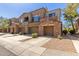 Inviting townhouse featuring 3 car garage with desert landscaping and tile roof at 19550 N Grayhawk Dr # 1044, Scottsdale, AZ 85255