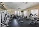 Community gym filled with modern exercise equipment, weights, and floor to ceiling windows at 19550 N Grayhawk Dr # 1044, Scottsdale, AZ 85255