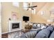 Inviting living room with a fireplace and a comfortable blue sectional sofa at 19550 N Grayhawk Dr # 1044, Scottsdale, AZ 85255