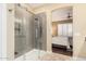 This primary bathroom features glass enclosed shower and seamless access to the main bedroom at 19550 N Grayhawk Dr # 1044, Scottsdale, AZ 85255