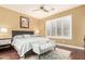 The primary bedroom features a ceiling fan, shuttered windows and a tufted bench at the foot of the bed at 19550 N Grayhawk Dr # 1044, Scottsdale, AZ 85255