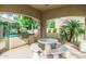 Outdoor community kitchen with built-in gas grill, seating, and desert landscaping at 19550 N Grayhawk Dr # 1044, Scottsdale, AZ 85255