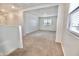 Spacious bedroom with neutral carpet, a bright window, and ample natural light, creating a comfortable atmosphere at 25437 W Mahoney Ave, Buckeye, AZ 85326
