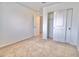 A carpeted bedroom featuring a closet with sliding doors at 25437 W Mahoney Ave, Buckeye, AZ 85326
