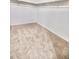 Spacious walk-in closet featuring neutral carpeting and ample storage with rods and shelving at 25437 W Mahoney Ave, Buckeye, AZ 85326