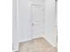 A hallway leads to a bathroom with a door at 25437 W Mahoney Ave, Buckeye, AZ 85326