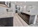 A view of the island with a sink and a dishwasher in the kitchen at 25437 W Mahoney Ave, Buckeye, AZ 85326