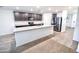 An open kitchen showcases dark cabinets, stainless appliances, and granite countertops at 25437 W Mahoney Ave, Buckeye, AZ 85326
