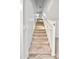 A carpeted staircase leading to the upper level of the house at 25437 W Mahoney Ave, Buckeye, AZ 85326