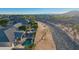 Scenic aerial view of a residential neighborhood with community drainage canal and mountain views at 25454 N 73Rd Ave, Peoria, AZ 85383