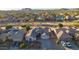 Aerial view of a home with a desert landscaped yard, a tile roof, and an attached two-car garage at 25454 N 73Rd Ave, Peoria, AZ 85383