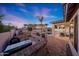 Backyard featuring a grill, outdoor kitchen, sparkling pool, pergola, and desert landscaping, perfect for entertaining at 25454 N 73Rd Ave, Peoria, AZ 85383