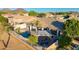 Spacious backyard featuring a private pool, pergola, and lush landscaping, perfect for outdoor entertaining at 25454 N 73Rd Ave, Peoria, AZ 85383