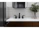 Modern bathroom featuring sleek vanity with white countertop and stylish matte black hardware at 25454 N 73Rd Ave, Peoria, AZ 85383
