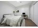 Bedroom featuring neutral color palette, ceiling fan, and closet doors at 25454 N 73Rd Ave, Peoria, AZ 85383