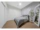 Bedroom featuring geometric accent wall and natural light at 25454 N 73Rd Ave, Peoria, AZ 85383