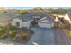 Well-maintained home featuring desert landscaping, a tile roof, a two-car garage, and a welcoming entrance at 25454 N 73Rd Ave, Peoria, AZ 85383