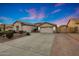 Charming single-story home featuring a spacious driveway and well-manicured landscaping at 25454 N 73Rd Ave, Peoria, AZ 85383