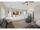 Comfortable living room features wood floors and custom built-in shelving with a TV at 25454 N 73Rd Ave, Peoria, AZ 85383