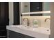 A close-up of double vanity sinks and modern fixtures in the main bathroom at 25454 N 73Rd Ave, Peoria, AZ 85383