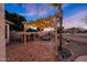 Cozy backyard pergola with an outdoor kitchen, bar seating, and a comfortable seating area, perfect for relaxing at 25454 N 73Rd Ave, Peoria, AZ 85383