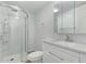 Bright bathroom featuring a glass-enclosed shower, granite countertop vanity, and modern fixtures at 2650 W Union Hills Dr # 51, Phoenix, AZ 85027