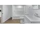 Bathroom with combination shower and tub, and a white single sink vanity with a large mirror at 2650 W Union Hills Dr # 51, Phoenix, AZ 85027