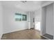 A bright bedroom with natural light, wood-look vinyl floors, and neutral paint at 2650 W Union Hills Dr # 51, Phoenix, AZ 85027