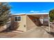 Charming single-story home with a covered porch, mature trees, and well-maintained landscaping at 2650 W Union Hills Dr # 51, Phoenix, AZ 85027
