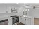 Beautiful kitchen featuring stainless steel appliances, quartz countertops, and elegant lighting at 2650 W Union Hills Dr # 51, Phoenix, AZ 85027