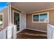 Inviting covered front porch with a stylish entry door and large windows that offer natural light at 2650 W Union Hills Dr # 51, Phoenix, AZ 85027