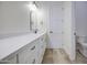 Bathroom featuring a large vanity, sleek mirror, with modern fixtures and a neutral color palette at 28003 N Faded Creek Dr, Florence, AZ 85132