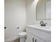 This bathroom features a white cabinet and sink, with clean walls and minimal decor at 28003 N Faded Creek Dr, Florence, AZ 85132