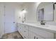 Bathroom with double sinks, modern fixtures, quartz counters and neutral color palette at 28003 N Faded Creek Dr, Florence, AZ 85132