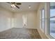 Bedroom with soft carpet, neutral walls, bright light and en suite bathroom at 28003 N Faded Creek Dr, Florence, AZ 85132