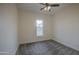This bedroom is bright and cozy with neutral carpet, paint, and a simple window at 28003 N Faded Creek Dr, Florence, AZ 85132