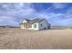 Expansive view of the house showcasing its architecture on a large lot with a beautiful sky at 28003 N Faded Creek Dr, Florence, AZ 85132